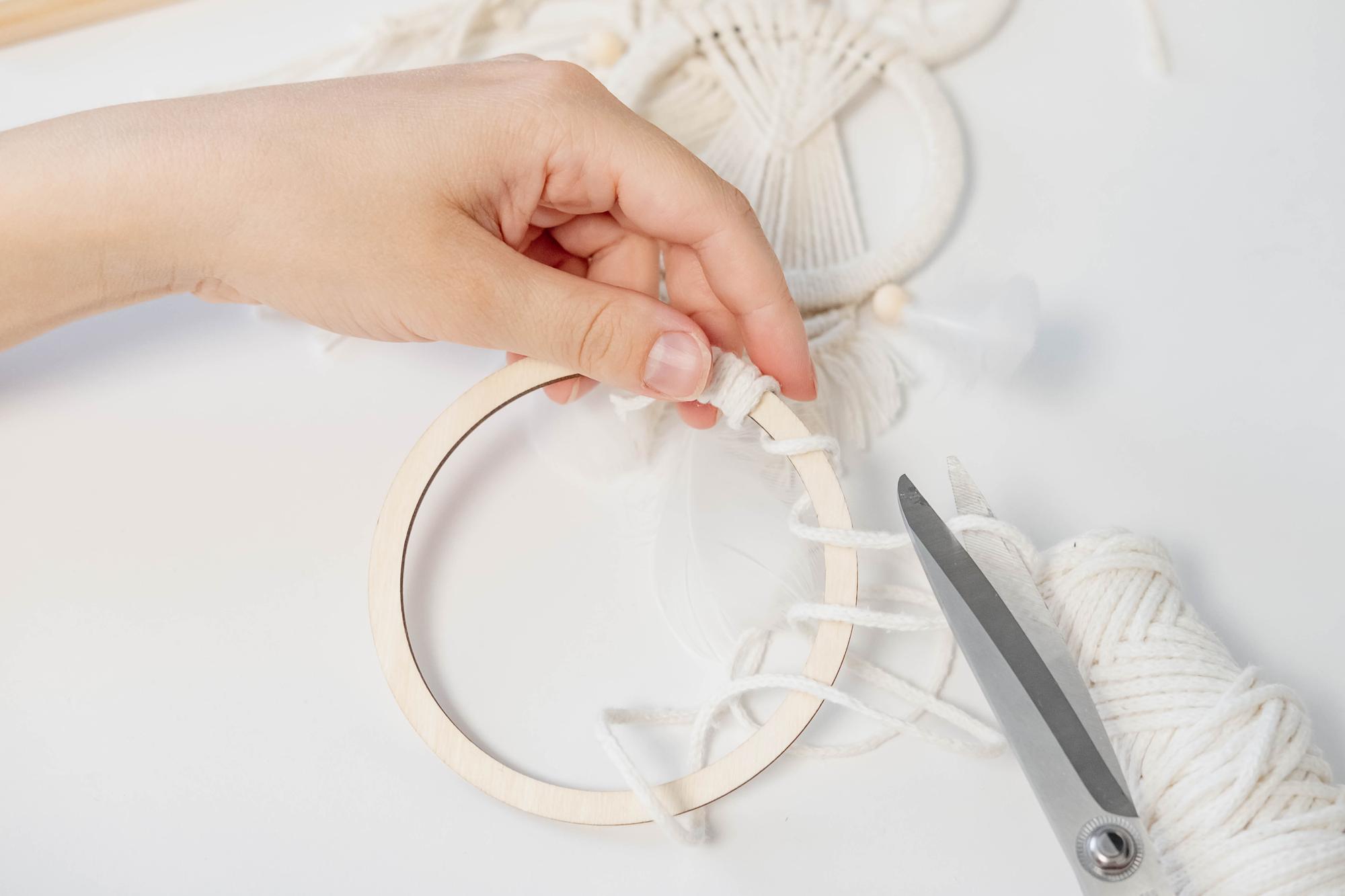 Woman embroidering floral pattern on linen